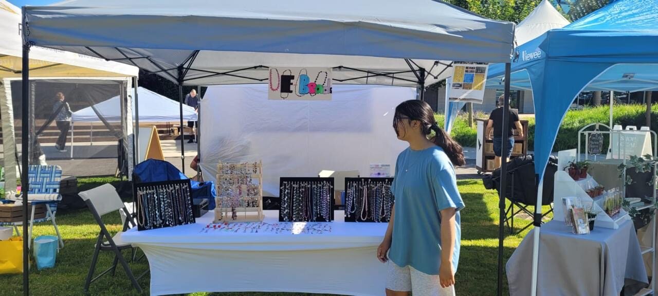 Outdoor EBeads stall with jewellery displays under a canopy